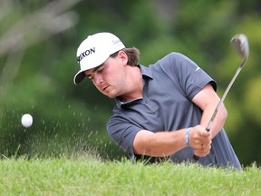 Aaron Cockerill chips out of the bunker during a practice round for the Players Cup on Wednesday. (Brian Donogh/Winnipeg Sun)