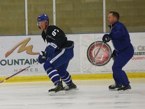 Defenceman Keaton Middleton is chased into the corner by a coach at the Toronto Maple Leafs Development Camp at the Gale Centre in Niagara Falls on Tuesday July 5, 2016. Jack Boland/Toronto Sun/Postmedia Network