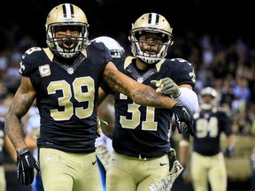 Former New Orleans Saints cornerback Brandon Browner reacts with free safety Jairus Byrd (31) after a penalty. (Derick E. Hingle-USA TODAY Sports)