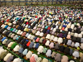 Thousands of Muslims gather to pray and to listen to a message from London Mosque imam Abd Alfatah Twakkal at the BMO Centre in London Wednesday in celebration of Eid, which marks the end of the month of Ramadan. (MIKE HENSEN, The London Free Press)