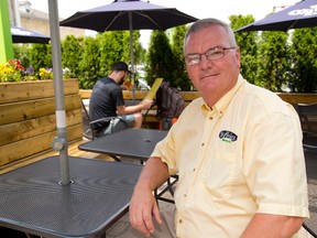Dennis Winkler, the general manager of Winks Eatery on Albert Street, says big outdoor festivals are good for his business near Victoria Park.  (MIKE HENSEN, The London Free Press)