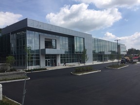 The new GoodLife Fitness corporate headquarters on Proudfoot Lane is almost complete with crews finishing paving and landscaping. About 300 employees will move in next month when the interior is completed. (HANK DANISZEWSKI, The London Free Press)