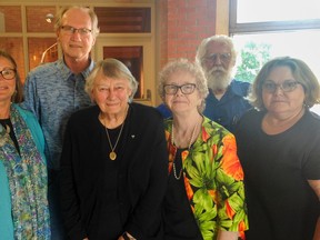 Audrey Cole (centre), the focus of a human rights complaint against the province, is surrounded by members of her support network, including longtime friend and advocacy ally Muriel Grace (second from the right) and her daughter Vici Clarke (right) who’ve fought their own battles for disability rights, at the tribunal held at the Kingston Frontenac Public Library central branch in Kingston, Ont. on Tuesday May 31, 2016. Jane Willsie for The Whig-Standard/Postmedia Network