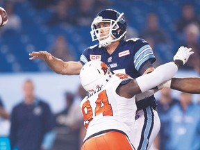 Argonauts QB Ricky Ray unloads a pass under pressure from the Lions during a game at the Rogers Centre. Ray is expecting more of the same tonight from a B.C. defence that has yielded just 21 points in two games. (The Canadian Press)