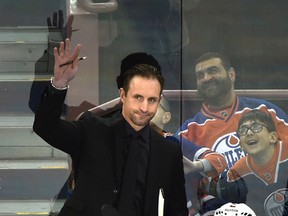 Former Edmonton Oilers Jason Smith now with the Ottawa Senators as a assistant coach, acknowledges the crowd during NHL action at Rexall Place in Edmonton, February 23, 2016. ED KAISER / Postmedia Network