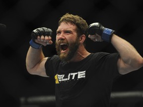 Mitch Clarke celebrates his bout win by submission against opponent Al Laquinta (not pictured) during their UFC 173 lightweight bout at MGM Grand Garden Arena. Stephen R. Sylvanie-USA TODAY Sports