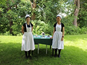 Two summer students at the Eldon House have prepared tea for patrons during the Eldon House Summer Tea program.