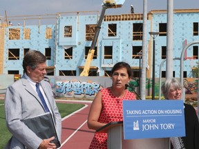 Mayor John Tory with Coucillor Ana Bailao (L) and Deputy Mayor Pam McConnell on Thursday July 7, at the Regent Park Athletic Grounds  2016. The Mayor announces 550 new housing allowances for those on the wait list for affordable housing. Veronica Henri/Toronto Sun/Postmedia Network
