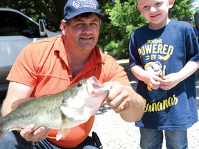 Mike Dean with Liam McGaw's 18-inch largemouth bass. (CHRIS ABBOTT/TILLSONBURG NEWS)