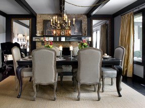 A beamed ceiling detailed with black paint, French antique style chairs and gold drapery create a calming mood.