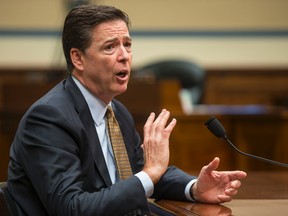 FBI Director James Comey testifies on Capitol Hill in Washington, Thursday, July 7, 2016, before the House Oversight and Government Reform Committee to explain his agency's recommendation to not prosecute Democratic presidential candidate Hillary Clinton over her private email setup during her time as secretary of state. (AP Photo/J. Scott Applewhite)