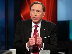 In this March 17, 2016 file photo, former CIA Director and retired Gen. David Petraeus is interviewed in New York. FBI Director James Comey stirred interest Thursday, July 7, 2016, when he said Petraeus hid materials in attic insulation while the agency pursued its case about his mishandling of classified information. Later, during his testimony on Hillary Clinton's email server, Comey said his staff told him he had misspoken.  (AP Photo/Richard Drew)