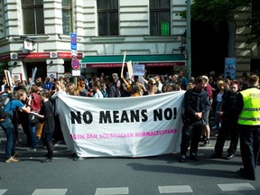 A photo taken on Juni 27, 2016 in Berlin shows people holding a giant banner reading 'No means no' as they demonstrate for againt sexual violence . After years of anguished discussion on the need for tougher treatment of rape by the German criminal justice system, German lower house of parliament approved on July 7, 2016 a landmark 'no means no' rape law who came together following a rash of sexual assaults in crowds on New Year's Eve in the western city of Cologne.  (JORG CARSTENSEN/AFP/Getty Images)