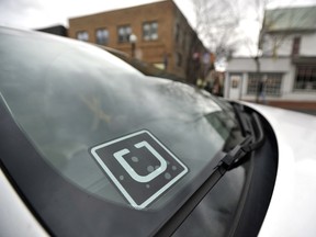 Uber drivers in Ontario will automatically be covered by a new insurance product approved by the Financial Services Commission of Ontario. AP