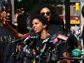 Janaya Khan of Black Lives Matter is angered by a question about whether they would shut down the Santa Claus parade. BLM held a press conference to speak about the mayor, police and PRIDE and what happened on the weekend and their demands as an organization on Thursday July 7, 2016. Jack Boland/Toronto Sun/Postmedia Network