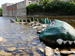 Luke Hendry/The Intelligencer
A rock creature rises out of the unusually low waters of the Moira River in downtown Belleville Thursday. Several months of below-average rainfall mean waterways are lower than usual and mean Quinte Conservation is unable to generate electricity from its McLeod Dam turbines.