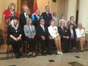 Premier Brian Pallister (top centre) and Lieut.-Gov. Janice Filmon (bottom centre) took part in a ceremony investing 11 Order of Manitoba recipients on Thursday. (DAVID LARKINS/WINNIPEG SUN)