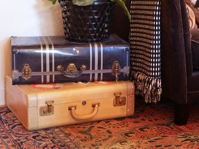 A few vintage suitcases make a stylish and practical living room side table or bedside surface.