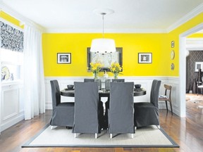 Lower panels painted a crisp white and topped off with a summery yellow make for a thoroughly liveable dining space.