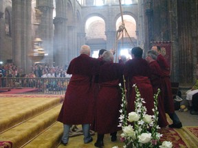 This June 22, 2014 photo shows men pulling on ropes to swing the massive incense burner called "botafumeiro" at a pilgrims' Mass inside the cathedral of Santiago de Compostela, Spain. Thousands of pilgrims from around the world walk the 500-mile ancient pilgrimage route  (Giovanna Dell'Orto via AP)