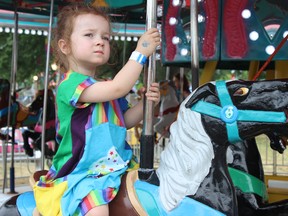 Samantha Reed/The Intelligencer
Two-year-old Emma of Belleville enjoys the carousel ride at the Belleville’s Waterfront and Ethnic Festival Friday afternoon at Zwicks Park. The festival kicked off on Thursday afternoon and runs throughout the weekend.