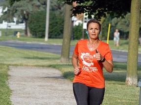 Kari Formosa of the Defiance Running Club runs on the new Wallace Street trail on Thursday, June 16. Both the Wallace Street trail and the Glen Mickle fitness trail were officially opened last month