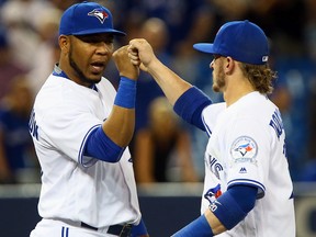 Edwin Encarnacion and Josh Donaldson of the Blue Jays celebrate a win over the Royals in Toronto on July 5, 2016. (Dave Abel/Toronto Sun)