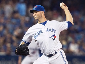 Blue Jays starting pitcher J.A. Happ throws against the Tigers during first inning MLB action in Toronto on Friday, July 8, 2016. (Fred Thornhill/The Canadian Press)