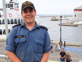 Ordinary Seaman Christopher Miller, a 21-year-old naval communicator on HMCS Kingston during her name-sake visit to Kingston, Ont. on Friday July 8, 2016. His parents, in the background, drove six hours from Dresden, Ont. to see him. Steph Crosier/Kingston Whig-Standard/Postmedia Network