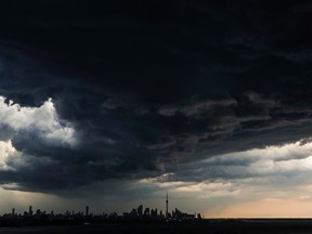 Storm clouds form over the skyline in Toronto, Monday June 6, 2016. THE CANADIAN PRESS/Mark Blinch