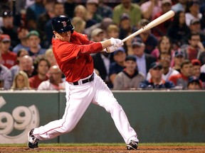 Aaron Hill launches one of his two hits during his Red Sox debut on Friday night. (AP)