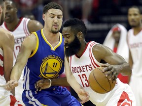 Houston Rockets’ James Harden, right, drives around Golden State Warriors’ Klay Thompson during Game 4 of their first-round NBA playoff series Sunday, April 24, 2016, in Houston. (AP Photo/David J. Phillip)