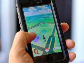 Pokemon Go is displayed on a cell phone in Los Angeles on Friday, July 8, 2016. (AP Photo/Richard Vogel)