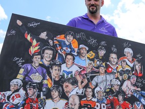 Aaron White of Brockville shows off his painting depicting 28 of the 33 sports celebrities at the Medigas Celebrity Classic charity golf tournament on Saturday July 9, 2016 in Belleville, Ont. White spent the day gathering signatures from each celebrity he painted. Tim Miller/Belleville Intelligencer/Postmedia Network