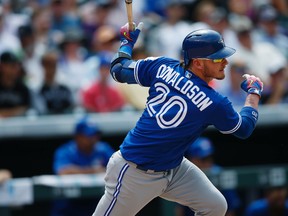 Toronto Blue Jays' Josh Donaldson singles on a pitch from Colorado Rockies relief pitcher Jordan Lyles during the seventh inning of a baseball game Wednesday, June 29, 2016, in Denver. Toronto won 5-3. (AP Photo/David Zalubowski)