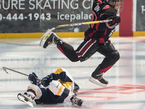 Team Alberta's Reid Varkonyi leaps over Pennsylvania's John Mooney during early action in the Brick super novice hockey tournament at West Edmonton Mall. The BC Junior Canucks won the event with a 5-1 victory over Minnesota on Sunday, July 10, 2016.