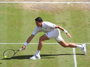 Canada's Milos Raonic returns to Britain's Andy Murray during the men's singles final match on the last day of the 2016 Wimbledon Championships at The All England Lawn Tennis Club in Wimbledon, southwest London, on July 10, 2016. (AFP PHOTO/John WALTON)
