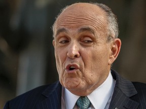 In this Oct. 16, 2014 file photo, lawyer and former New York City mayor Rudy Giuliani is pictured outside Los Angeles Superior court in Los Angeles. (AP Photo/Damian Dovarganes, File)