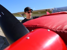 First Peoples' Aviation student, Dave Webster,  does a thorough check of one of the school's planes before a flight on Tuesday May 31, 2016 in Tyendinaga Mohawk Territory, Ont. Tim Miller/Belleville Intelligencer/Postmedia Network