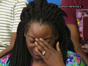 In this image made from video provided by KDFW-FOX4, Shetamia Taylor reacts during a news conference at Baylor University Medical Center in Dallas on Sunday, July 10, 2016. (Courtesy of KDFW-FOX4 via AP)