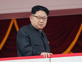 In this May 10, 2016, photo, North Korea's leader Kim Jong Un watches a parade from a balcony at the Kim Il Sung Square in Pyongyang. The U.S. imposed sanctions Wednesday, July 6, 2016, on North Korean leader Kim Jong Un and 10 other top officials for human rights abuses in an escalation of Washington's effort to isolate the authoritarian government. (AP Photo/Wong Maye-E)