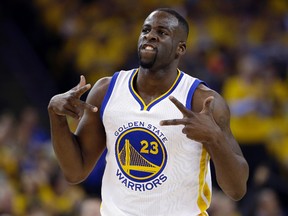 In this April 27, 2016, file photo, Golden State Warriors' Draymond Green celebrates after scoring against the Houston Rockets during the first half in Game 5 of a first-round NBA basketball playoff series, in Oakland, Calif. Green was arrested for an alleged assault over the weekend in East Lansing, Michigan, according to online court records. (AP Photo/Marcio Jose Sanchez, File)