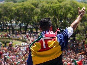 Portugal's forward Cristiano Ronaldo waves to his fans as he celebrates their victory at Belem Palace on July 11, 2016 after their Euro 2016 final football win over France the day prior. (AFP PHOTO / NUNO FOX)