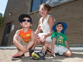 Carmen Perron, seen here with Noah Marois, 3, (L) and his brother Cedric, 2, is the director of the daycare that was under threat to close after its federal funding was revoked. It has now received a lifeline from the Liberal government amounting to a rent freeze until 2019.   Wayne Cuddington/ Postmedia