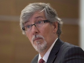 Privacy commissioner Daniel Therrien waits to appear at the Commons human resources committee in Ottawa in an April 20, 2016, file photo. Companies that lose personal customer data should be required to directly notify affected people - with limited exceptions - about the nature and date of the lapse along with steps taken to reduce the harm, says the federal privacy watchdog. THE CANADIAN PRESS/Adrian Wyld, File