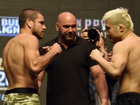 UFC President Dana White (C) looks on as mixed martial artists Jim Miller (L) and Takanori Gomi face (R) off during their weigh-in for UFC 200 at T-Mobile Arena on July 8, 2016 in Las Vegas, Nevada. The fighters will meet in a lightweight bout on July 9 at T-Mobile Arena.  (Photo by Ethan Miller/Getty Images)