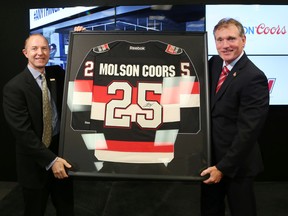 Stewart Glendinning, CEO of Molson Coors Canada, and Cyril Leeder, president of the Ottawa Senators, announced a renewed partnership in Ottawa on July 11, 2016. (Jean Levac/Postmedia)