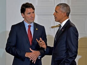 Canadian Prime Minister Justin Trudeau talks with US President Barack Obama during a working dinner at the Presidential Palace during the NATO Summit in Warsaw on July 8, 2016. (JANEK SKARZYNSKIJANEK SKARZYNSKI/AFP/Getty Images)