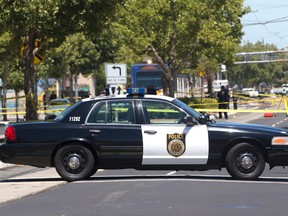 Crime scene tape surrounds the area as Sacramento Police officers investigate the fatal shooting of a knife-waving suspect by police, Monday, July 11, 2016, in Sacramento, Calif. (AP Photo/Rich Pedroncelli)