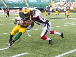 Joe McKnight, shown here being chased in the season opener against the Ottawa RedBlacks, turned over the ball on two returns against the Saskatchewan Roughriders. (The Canadian Press)